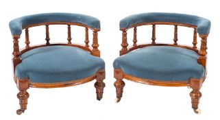A pair of Victorian mahogany and upholstered low tub armchairs, circa 1870,