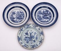 A pair of Chinese porcelain plates and one other: the former painted with an extensive lakeside