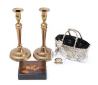 A pair of late 18th century brass candlesticks: with urn-shaped sconces on tapering stems and