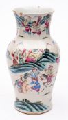 A Chinese famille rose baluster vase: painted with dignitaries on horseback and attendants holding