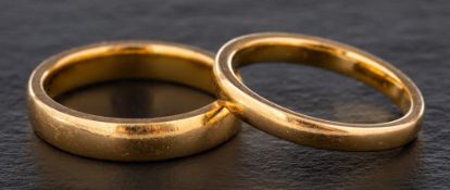 Two 22ct gold band rings,: one with hallmarks for Birmingham, 1962,