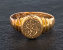 An 18ct gold signet ring,: engraved with monogram, with hallmarks for Birmingham, 1894,