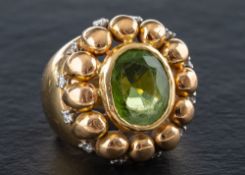 A cushion-cut peridot and single-cut diamond dress ring,: calculated weight of peridot ca. 5.