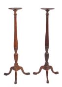 A pair of mahogany torchere or vase stands in George III style, 19th century,