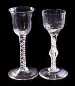 Two 18th century English wine glasses: one with ogee bowl and on a double opaque and air twist stem,