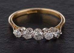 A round, brilliant-cut diamond, five stone ring,: estimated total diamond weight ca. 0.