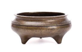 A Chinese bronze tripod censer: of squat circular form,
