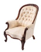 A Victorian mahogany and button upholstered armchair, circa 1870,