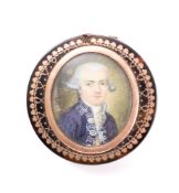 A late 18th century tortoiseshell and gold piquet work snuff box: of circular outline,