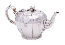 A George V silver teapot, maker Elkington & Co, Birmingham, 1919: of lobed melon-shaped outline,
