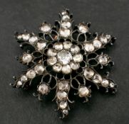 A silver Georgian/ early Victorian openwork, foiled, closed back, rose-cut, flowerhead brooch,