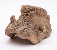 A large Chinese terracotta ridge tile: in the form of a dragon's head,
