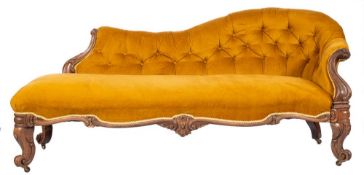 A Victorian carved rosewood and upholstered chaise longue, mid 19th century,