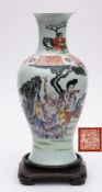 A Chinese famille rose baluster vase: enamelled with a presentation scene depicting the Immortal