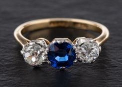 A cushion-cut synthetic sapphire and old-cut diamond three stone ring,
