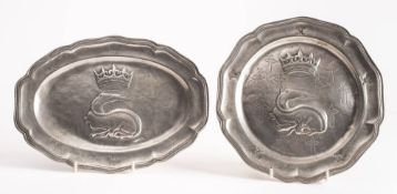 A 19th century French pewter dish: of oval outline with embossed decoration of a crowned salamander