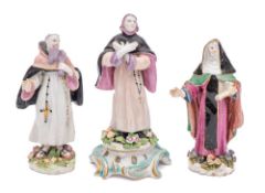 A matched pair of Bow standing figures of an Abbot & Abbess together with a similar figure of an