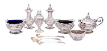 A collection of assorted silver condiments, various makers and dates: includes salts, pepperettes,