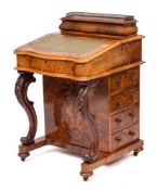 A Victorian walnut serpentine front Davenport, circa 1870,