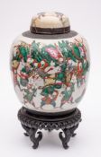 A Chinese 'crackle ware' jar and cover: of oviform decorated in colours with numerous warriors