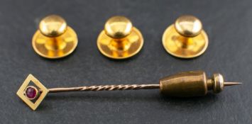A set of dress studs and a ruby stickpin,: stamped '18ct', diameter ca. 1cm, weight ca. 2.8gms.
