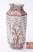 A Chinese inscribed famille rose vase: of hexagonal form with waisted neck and everted rim,