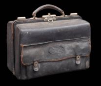 A late Victorian leather travelling vanity case: enclosing clear glass and silver mounted jars,