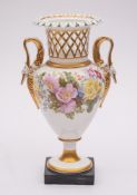 An early 19th century English porcelain two-handled vase: in Swansea style with pierced basketwork