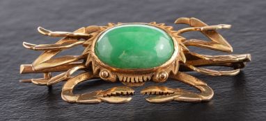 A mid-20th century, crab jade brooch,: stamped '14K', length ca. 4.5cm, total weight ca. 8.3gms.