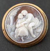A 9ct gold shell cameo,: depicting a courting couple, hallmarks for Birmingham, 1987, length inc.