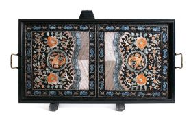 A pair of Chinese embroidered rank badges: centred with a phoenix bird amongst flowering shrubs,