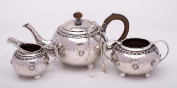 A George V hammered silver three-piece tea service, maker Liberty & Co, Birmingham,