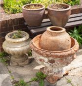 A group of five various terracotta and stoneware garden pots and urns, late 19th and 20th century,