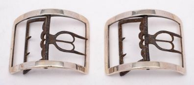 A pair of Georgian silver and steel buckles, unmarked: of plain rectangular outline, 7.5cm wide.