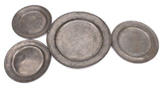 A large 18th century pewter charger: of plain circular form with moulded rim, touch marks worn. 51.