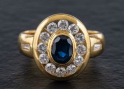 A sapphire and diamond cluster ring,: calculated sapphire weight ca. 0.