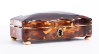 A Victorian blonde tortoiseshell trinket box: of serpentine outline,