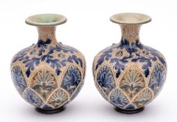A pair of Doulton Lambeth vases: of globular form with raised flaring neck decorated with jewelled