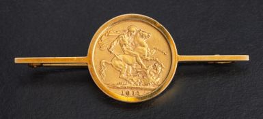 A 9ct gold bar brooch set with a George V full gold sovereign coin, 1911,