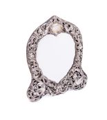 A late Victorian silver framed easel mirror, maker WC, London, 1892: monogrammed, of arched outline,