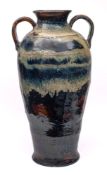 A monumental Malaysian two handled stoneware vase: of baluster form,