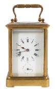A Victorian French brass carriage alarm clock: the eight-day duration movement having a later