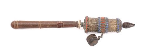 A Tibetan prayer wheel: with wooden and enamel bound spinning top with chained weight,