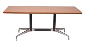 A North American walnut and metal mounted dining table by Herman Miller,