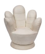 A contemporary upholstered revolving easy chair in the form of a stylised upturned hand,