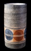 A Troika pottery cylinder vase: decorated with a band of square and circle motifs bisected by