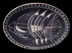 A Vallauris white earthenware dish: engraved with an abstract fish within a similar line and circle