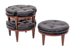 A set of three stained hardwood and leatherette cushioned stacking stools, circa 1970s,