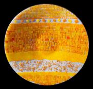 A large art glass dish: of circular form the clear and white speckled ground applied with orange