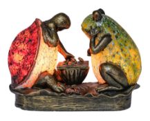A late 20th century novelty resin lamp: in the form of a seated turtle and frog playing chess,